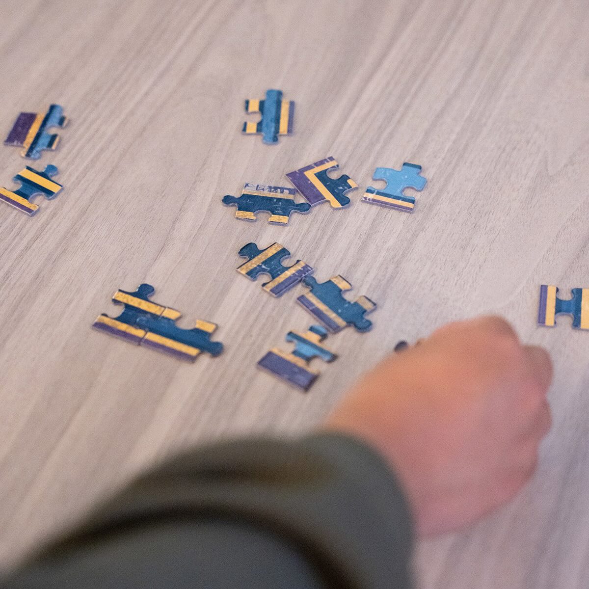 A person putting together a puzzle